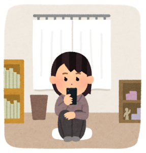 自宅でスマホで調べている